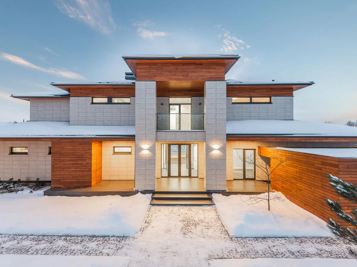 Contemporary country house with a stone and timber facade