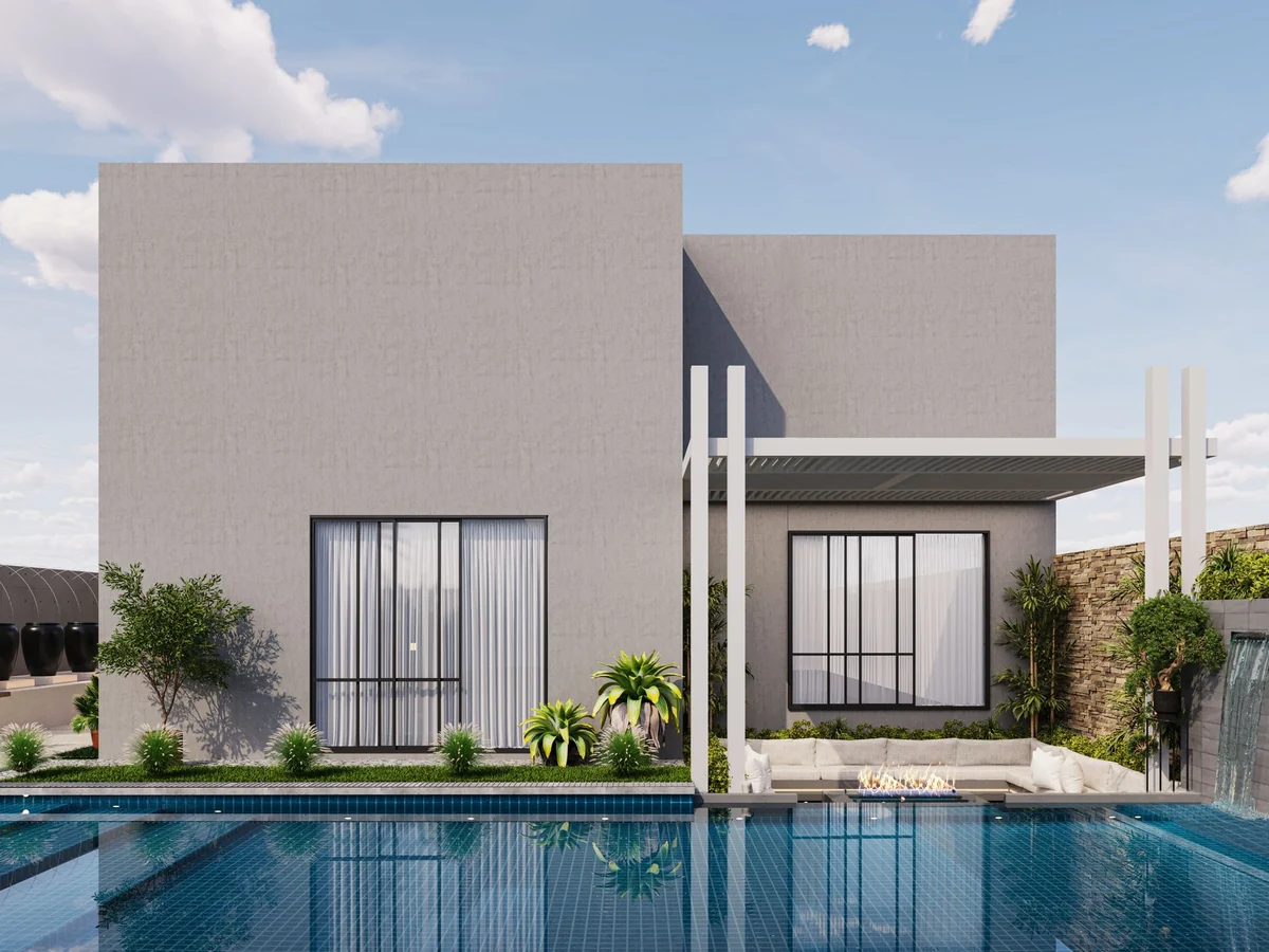 Low-slung villa beside a still reflecting pool